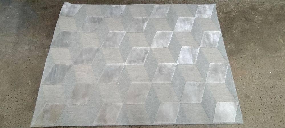 Lot 193: Dunelm Sienna Grey patterned rug. Measures approx 120...