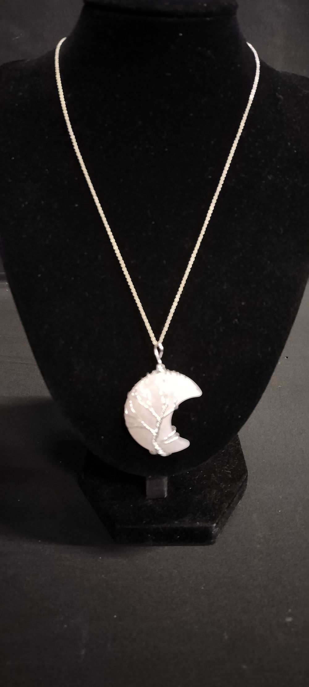 Lot 205: Sterling silver necklace and rose quartz moon pendant...