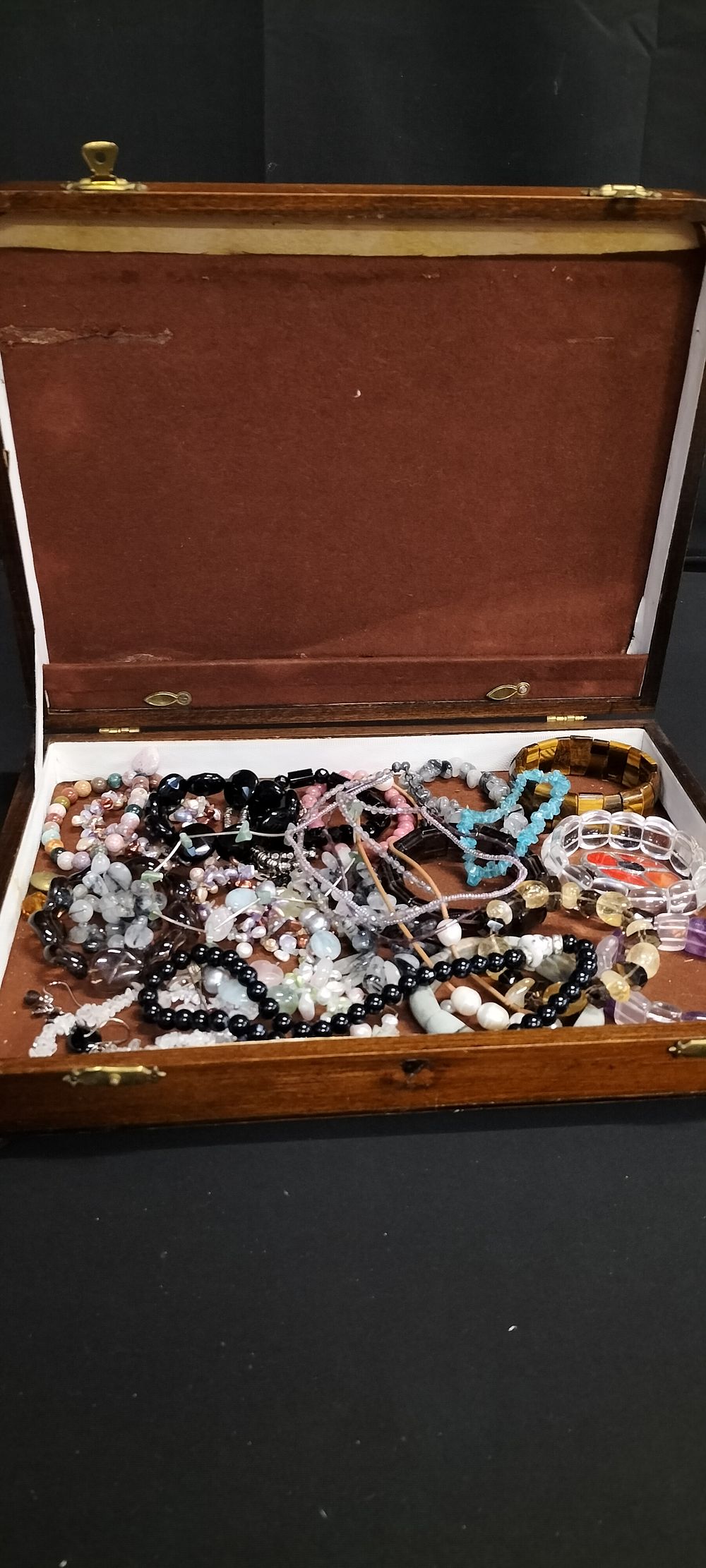 Lot 209: Box containing various Semi precious bracelets including tigers...