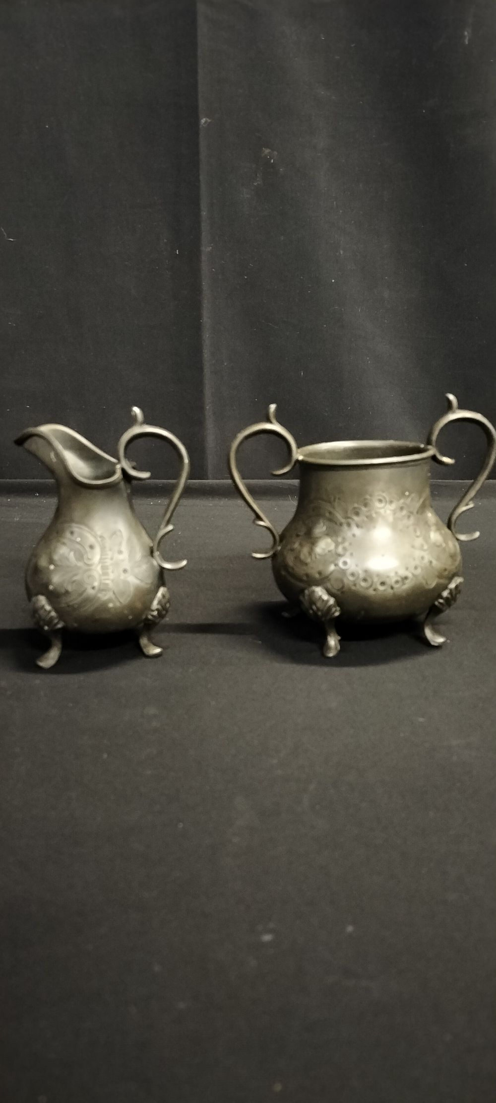 Lot 213: Two pewter items, milk jug and sugar bowl
