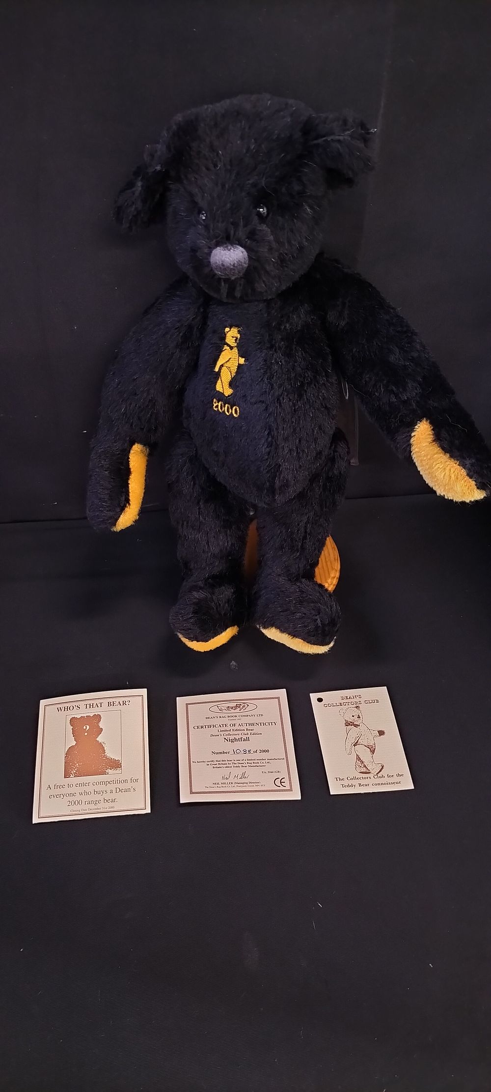 Lot 226: Dean's Nightfall black bear with golden pads and...