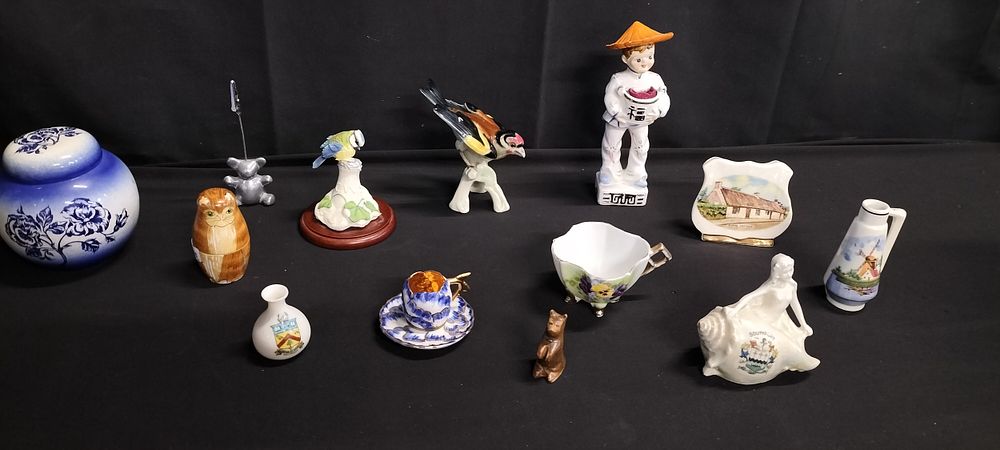 Lot 244: Box of mixed ornaments including figurines with pin...