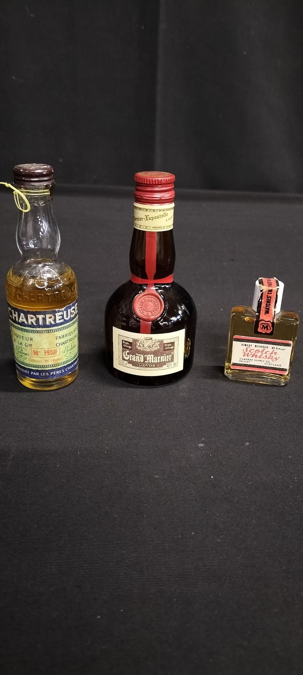 Lot 249: Three miniature bottles of unopened alcohol, Chartreuse, Grand...
