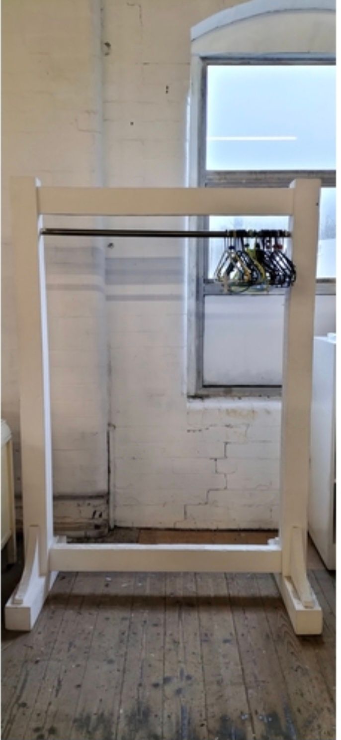 Lot 395: Painted Solid wood Large clothes display rail. With metal hanging bar. Measures approx H 173.5 x W 120 x D 60 cm. Collection only