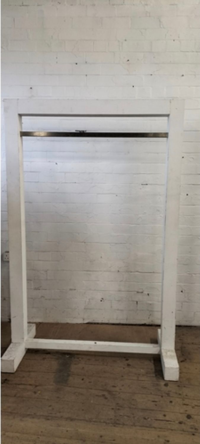 Lot 397: Painted Solid wood Large clothes display rail. With metal hanging bar. Measures approx H 180.5 x W 118.5 x D 45 cm. Collection only