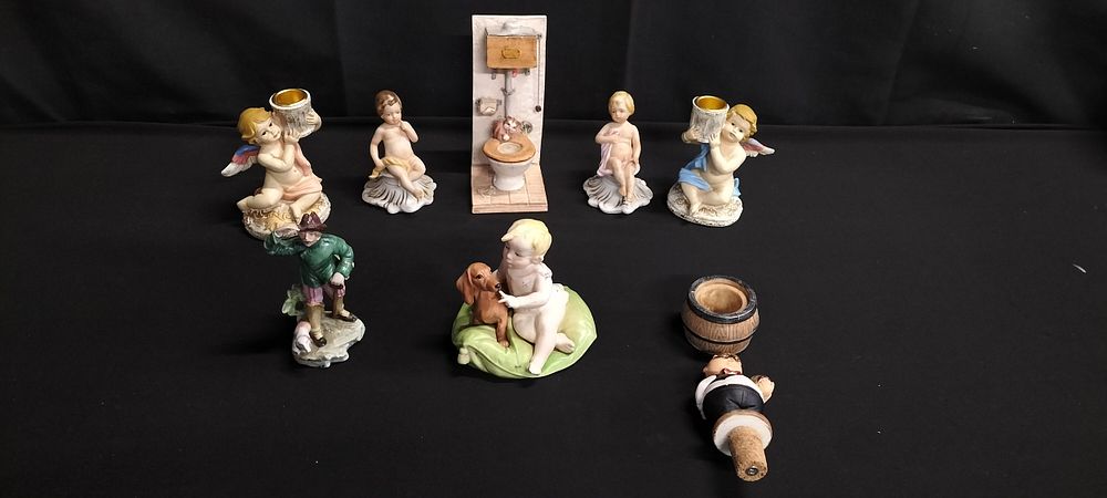 Lot 302: Mixed lot including cherub candle holders, and other...