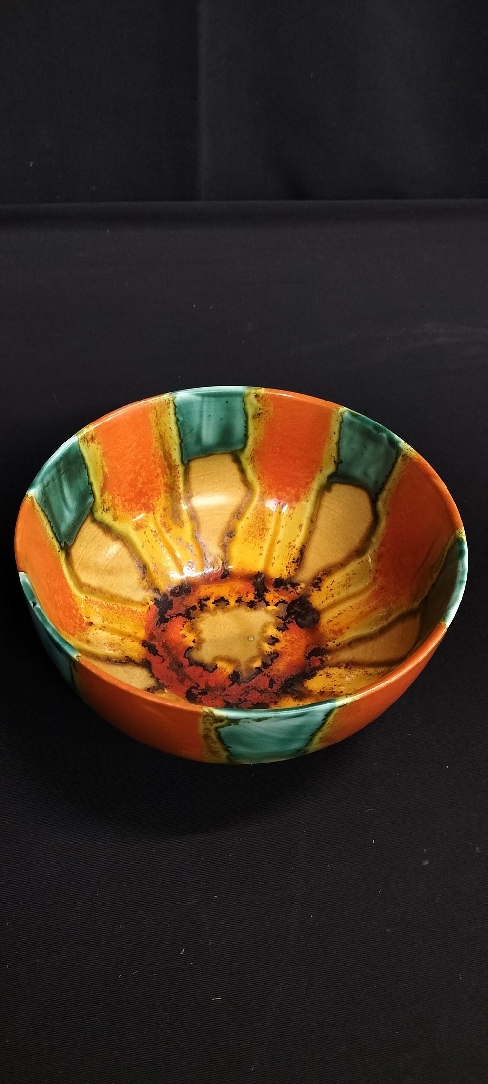 Lot 318: Hand made drip glaze bowl. Measures approx 7.5...