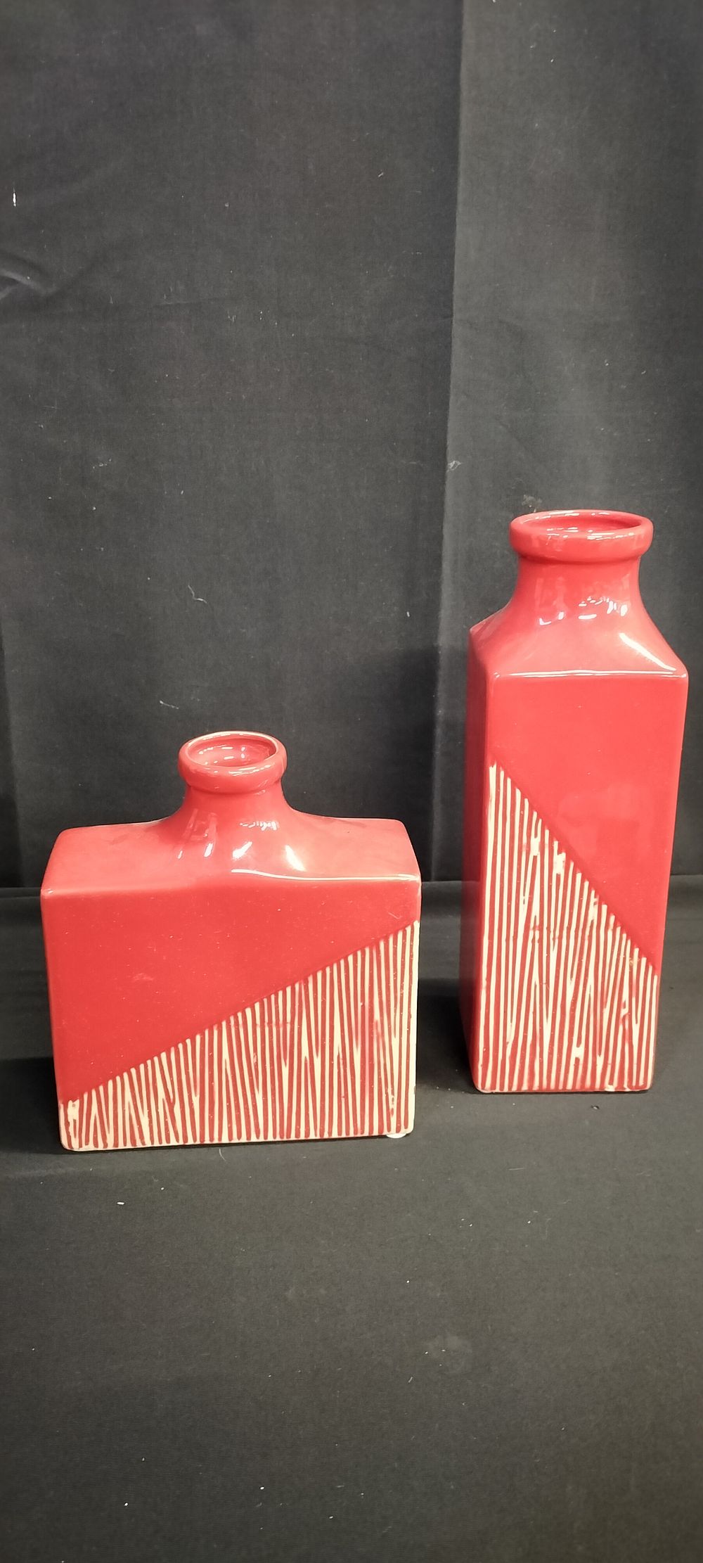 Lot 329: Two various sized Red and cream vases