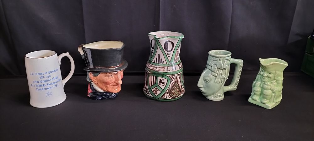 Lot 347: Collection of character jugs from various places and...