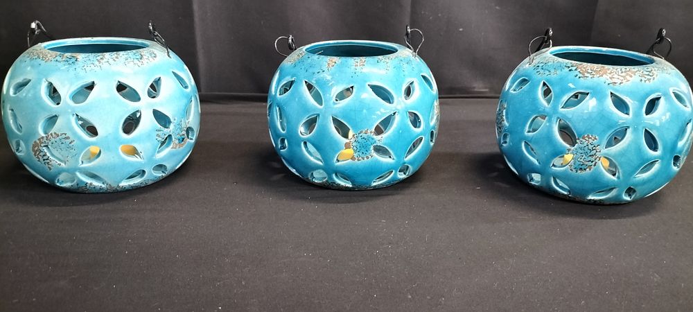 Lot 350: Three blue glazed hanging pottery battery operated lanterns