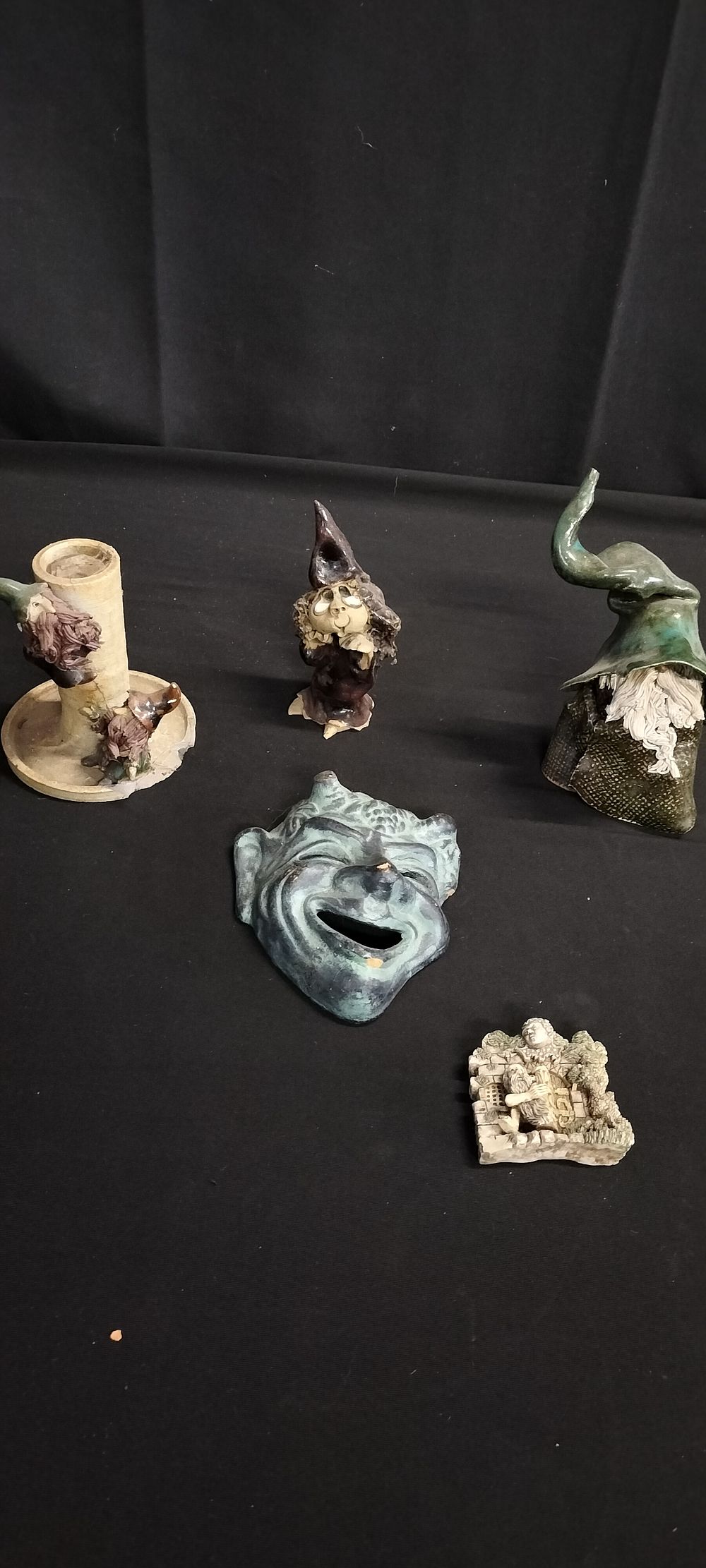 Lot 372: Various pottery figurines of wizards and a faun...