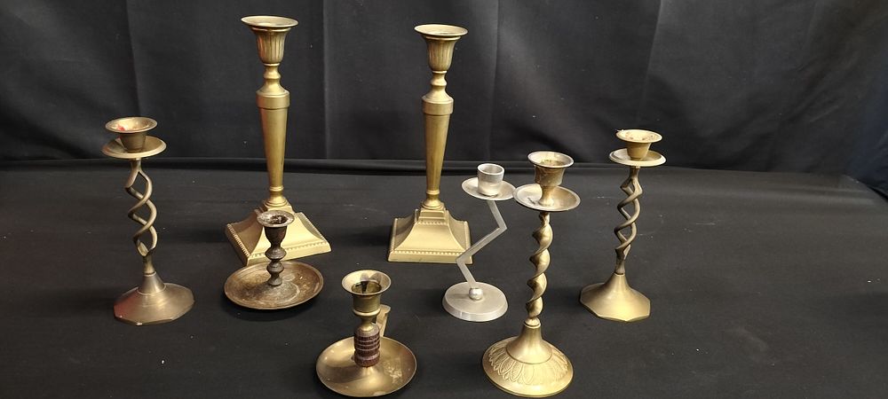 Lot 377: 8 various brass candle holders