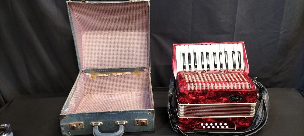 Lot 401: Vintage German Bell Accordion in red metallic swirl...