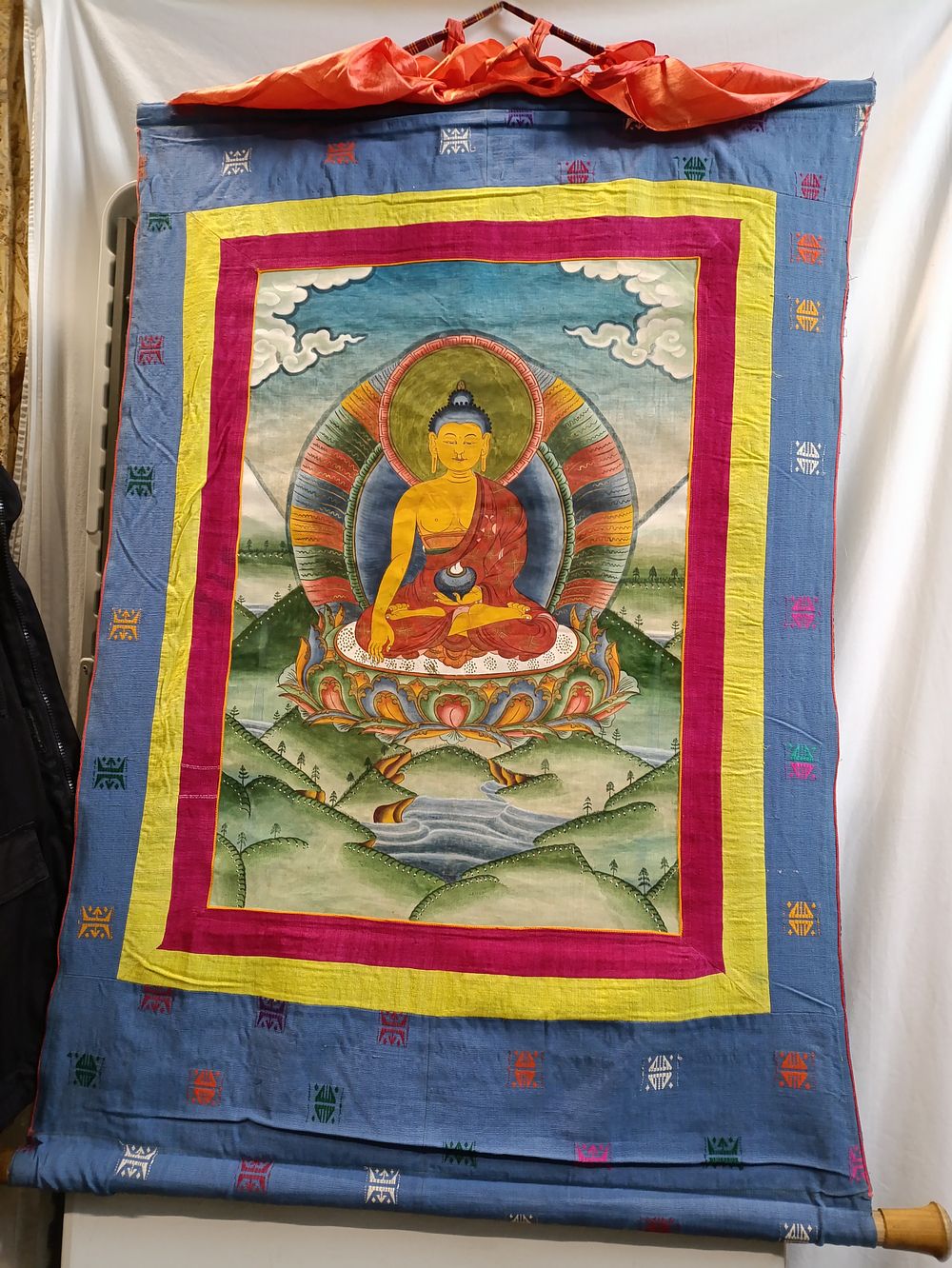 Lot 402: Tibetan wall hanging with a painted Buddha, measuring...