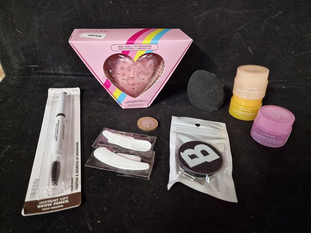 Lot 321: Selection of New Make Up Items inc Make Up Sponge and Lip Sleeping Masks