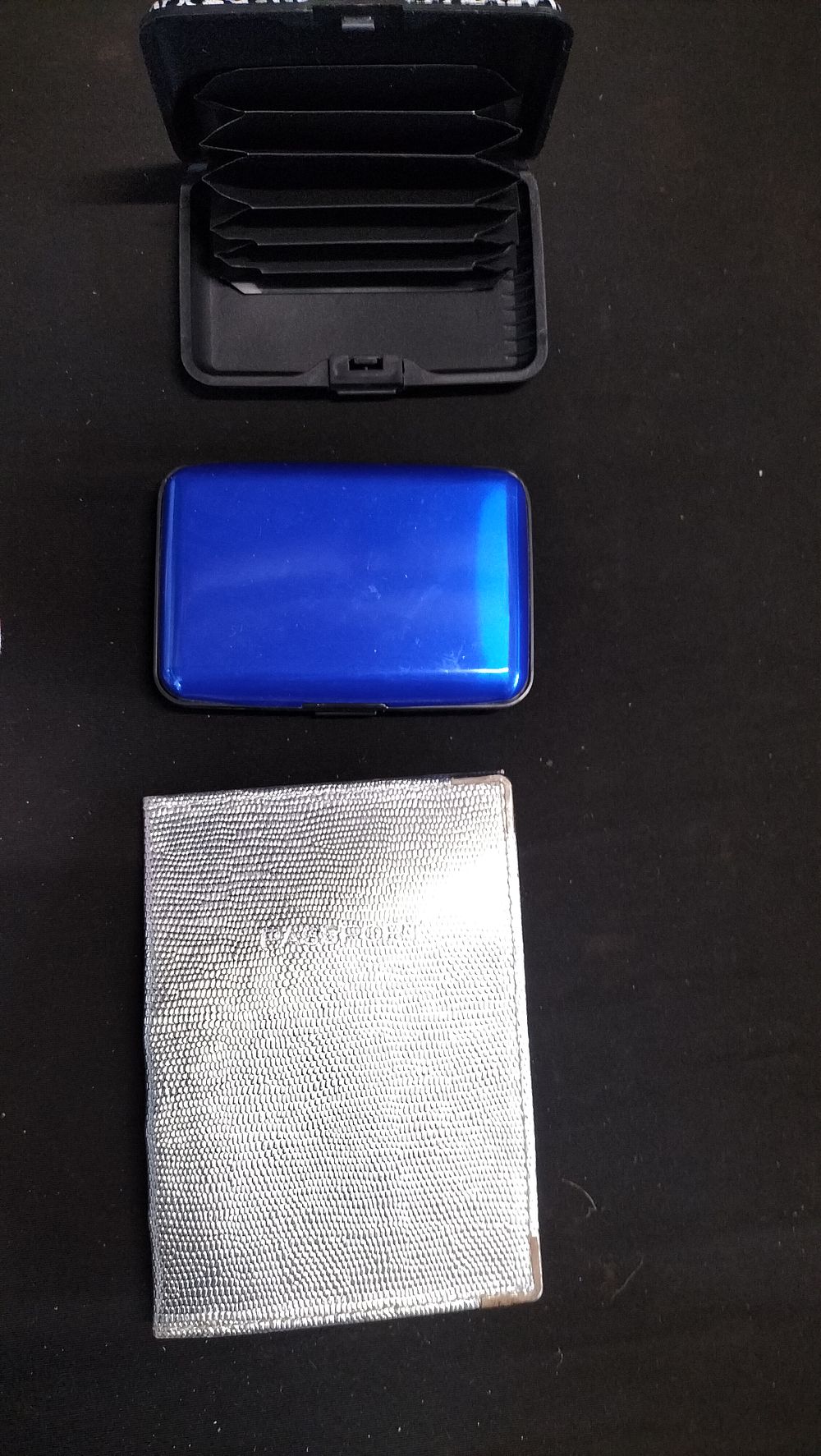 Lot 574: Two hard shell card holders and a silver...