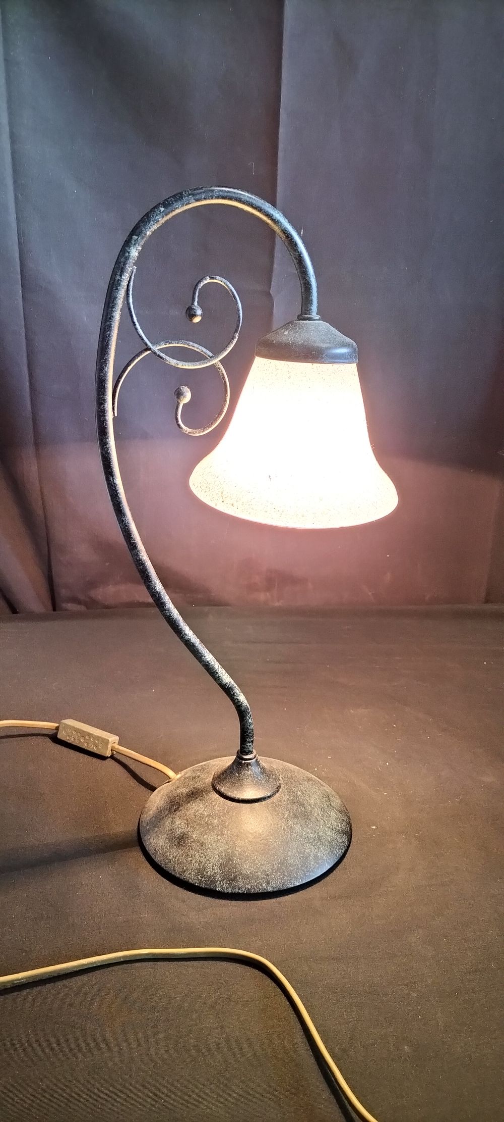 Lot 594: Metal scroll table lamp with glass frosted shape 