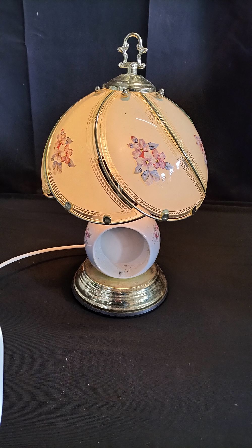 Lot 597: Brass and porcelain touch lamp with glass shade 