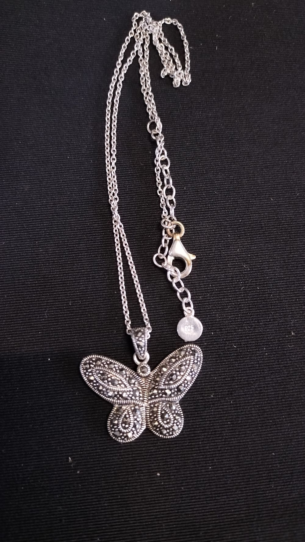 Lot 627: Sterling silver Marcasite butterfly pendant on a sterling...