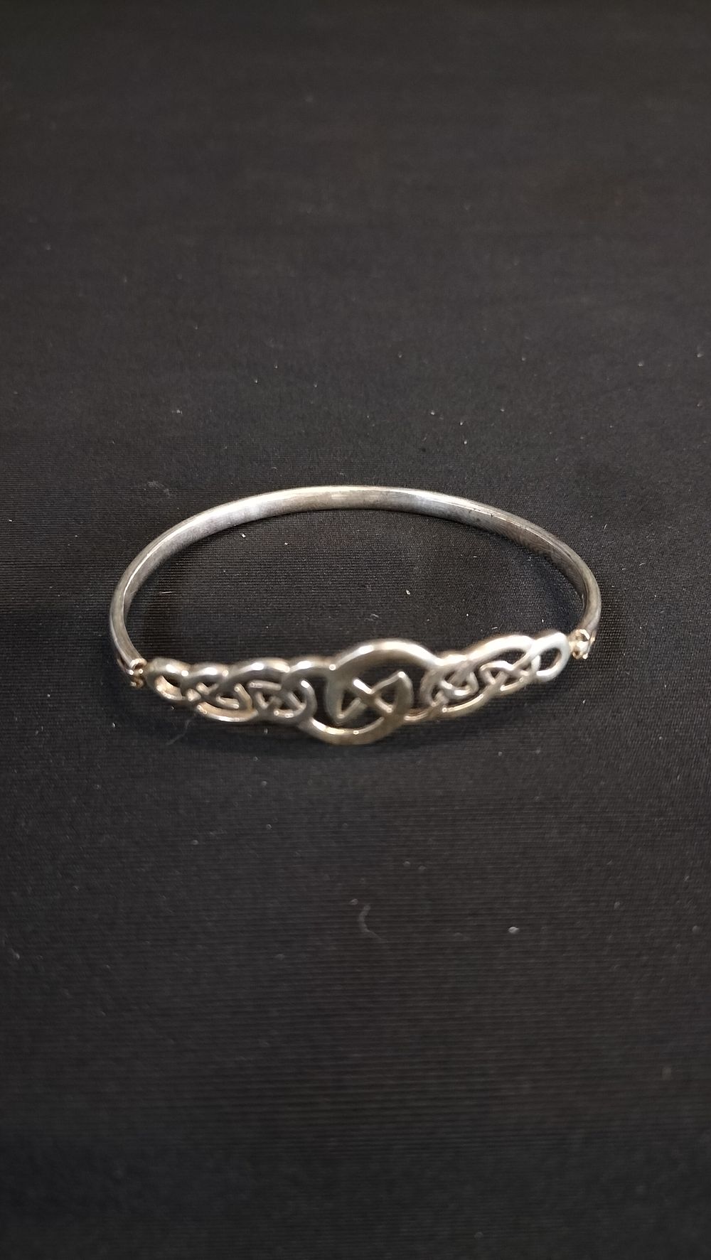 Lot 629: Sterling silver bracelet with Celtic design 
