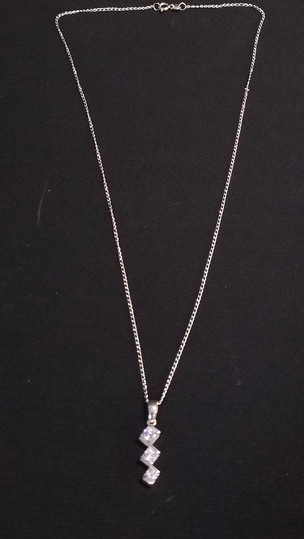 Lot 638: Sterling silver necklace with diamante pendant 