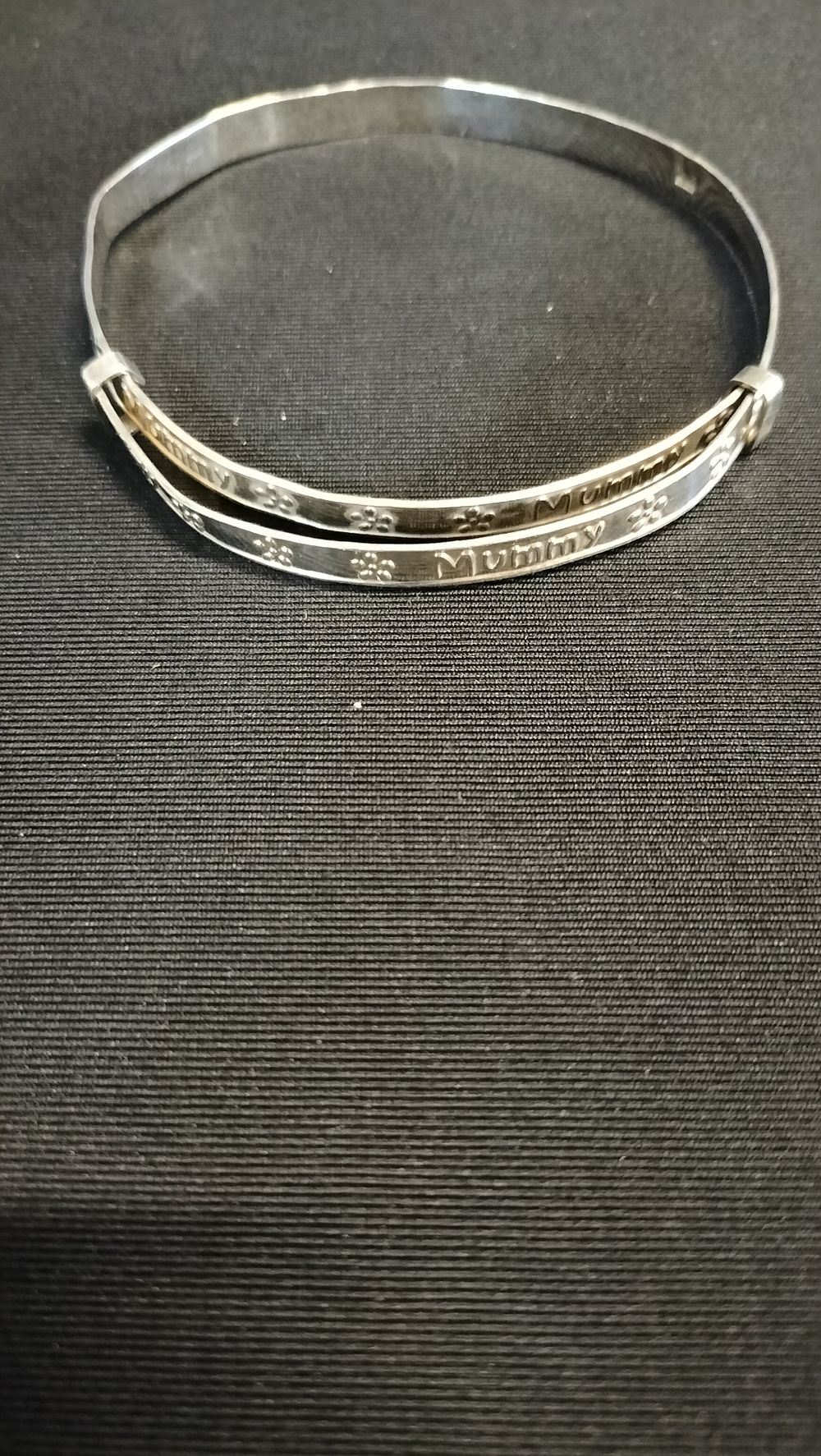Lot 690: Sterling silver bracelet with mummy embossed 