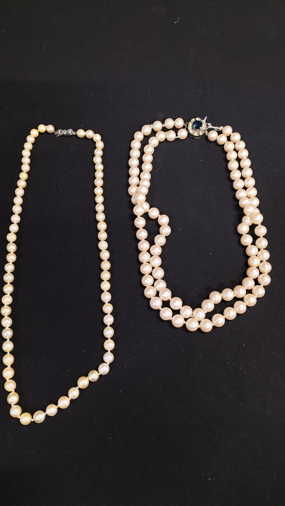 Lot 700: Two pearl necklaces with sterling silver clasps 