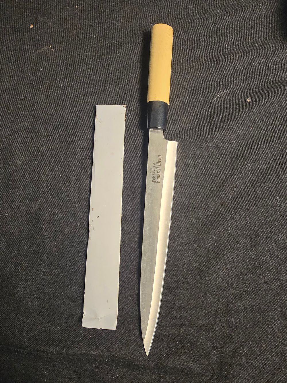 Lot 657: Magic home chef press n wrap kitchen knife