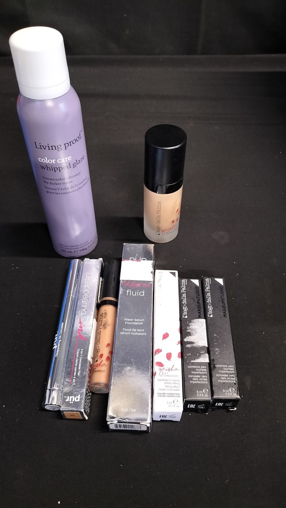 Lot 712: 9 various makeup items including living proof colour...