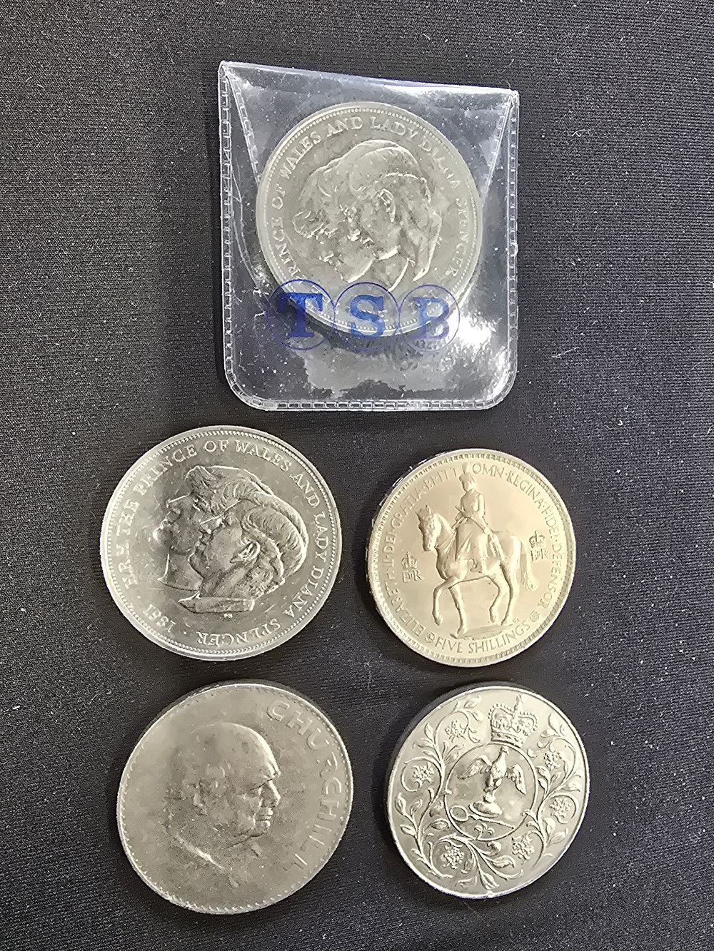 Lot 575: A collection of five commerative coins, five shillings...
