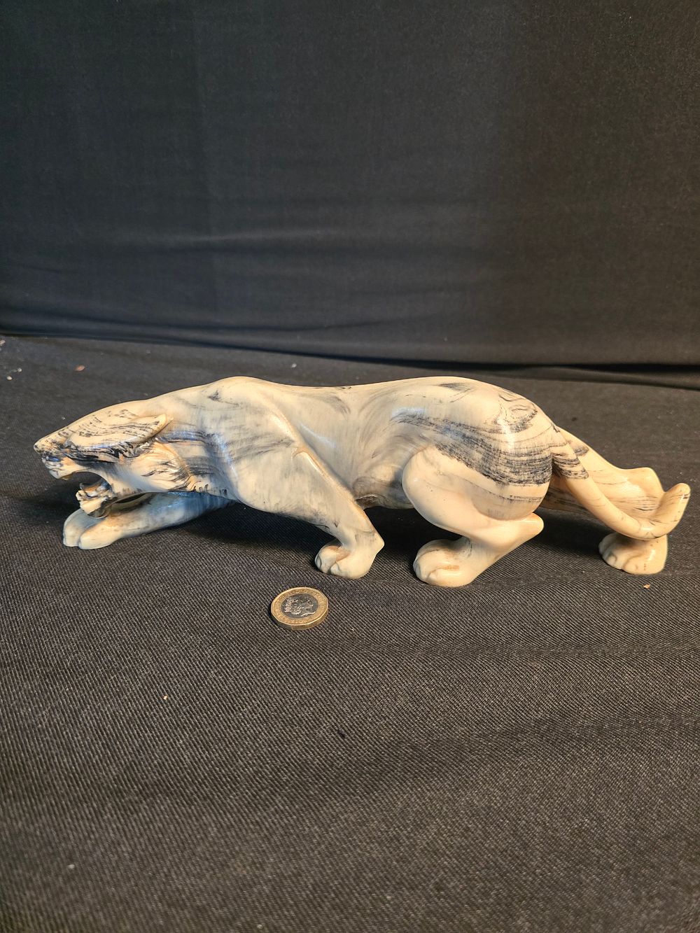 Lot 592: Approximately 28cm L prowling tiger made from resin