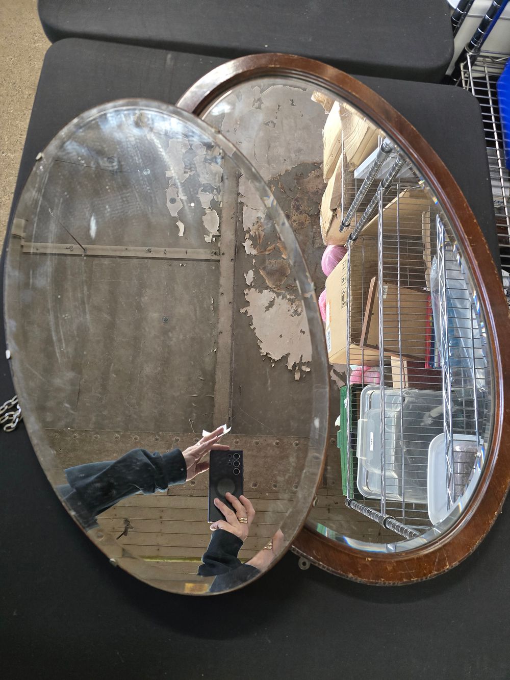 Lot 604: Two large vinatge level edged oval mirrors