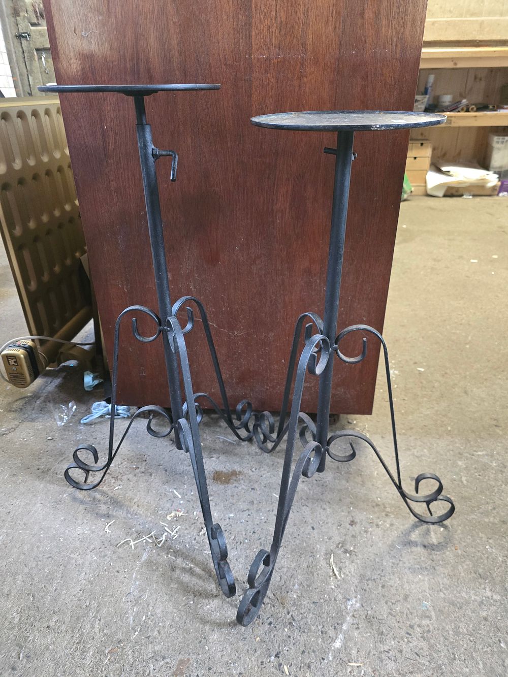 Lot 645: A pair of black cast metal plant stand...