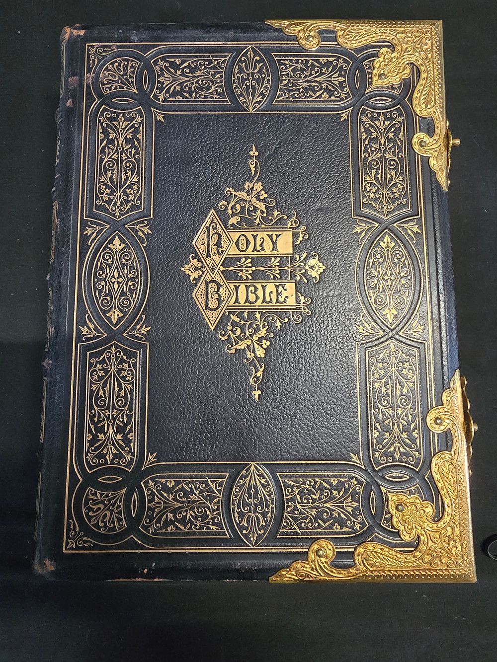 Lot 654: A vintage Holy Bible with brass fitting and...
