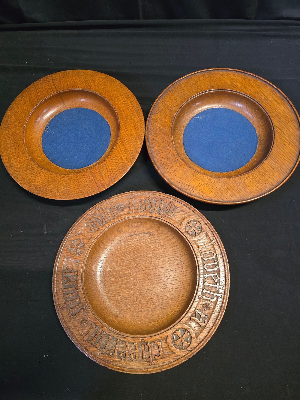 Lot 655: Three vintage solid wood religious church collections plates