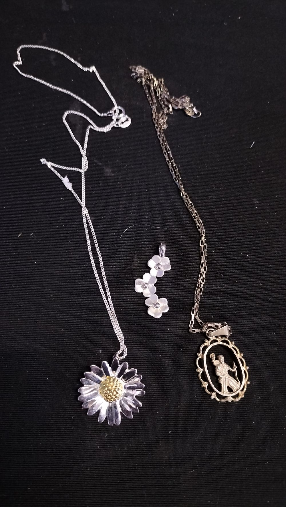 Lot 553: Sterling silver st Christopher with pierced work. Chain...