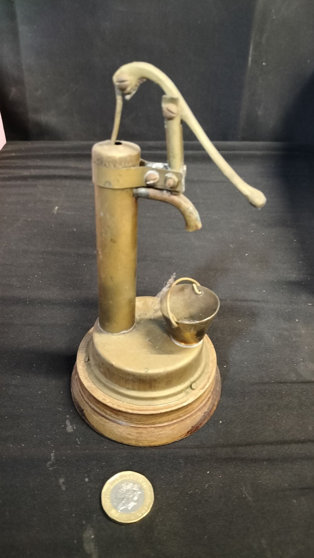 Lot 579: Brass water pump ornament 