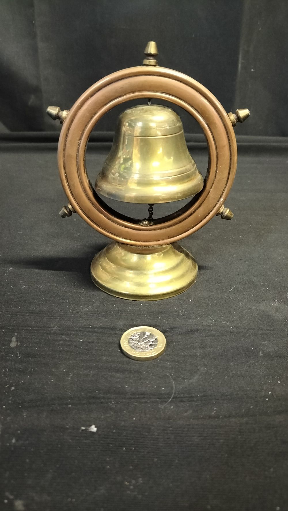 Lot 607: Brass bell inside a copper ships wheel 