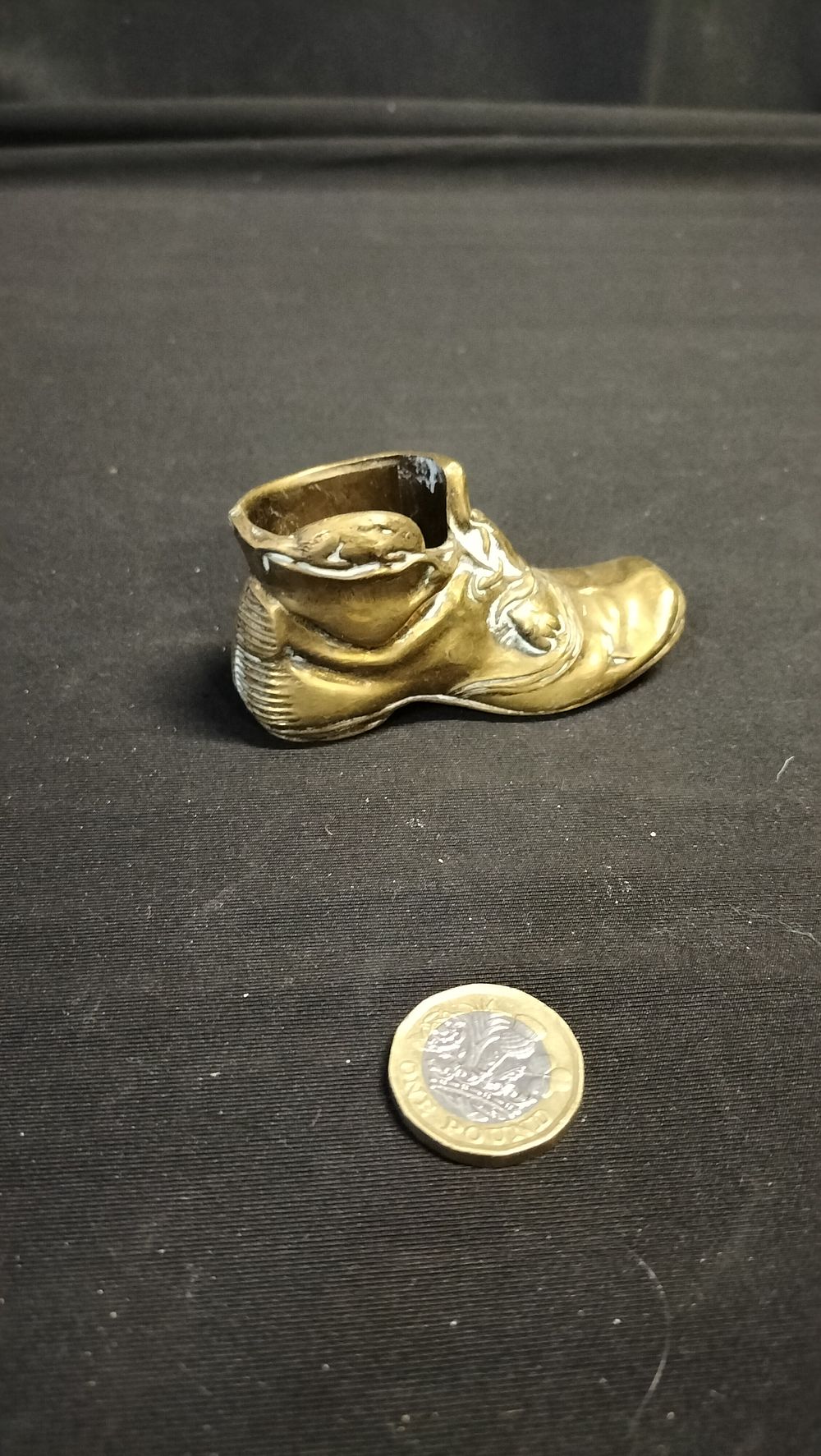 Lot 609: Brass boot match holder with striker 