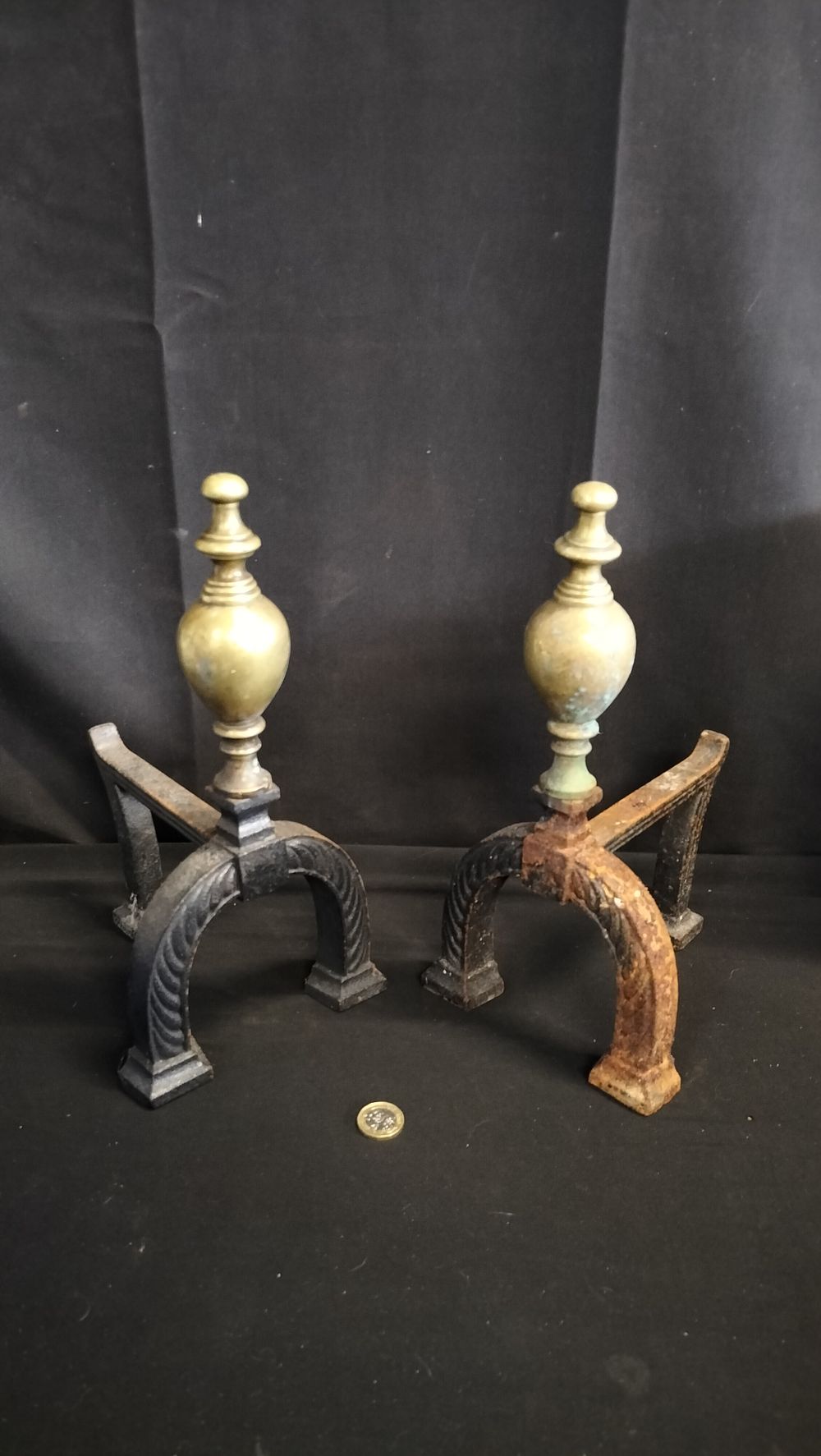 Lot 658: Two brass and cast metal fire dogs 