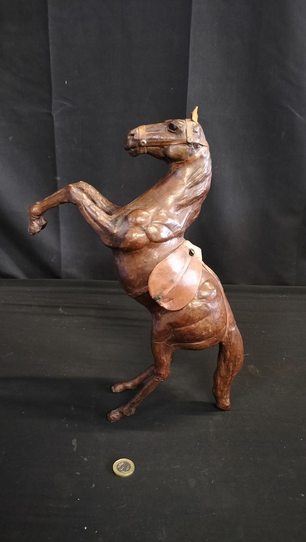 Lot 677: Brown leather horse in a rearing stance 