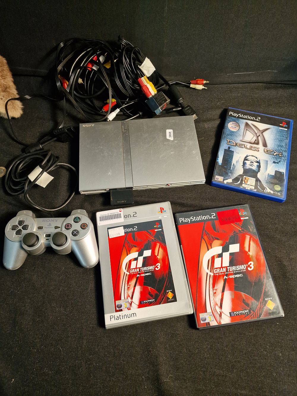 Lot 364: Vintage PS2 Slimline Console, Controller, Leads and Games. A/f NO POWER LEAD