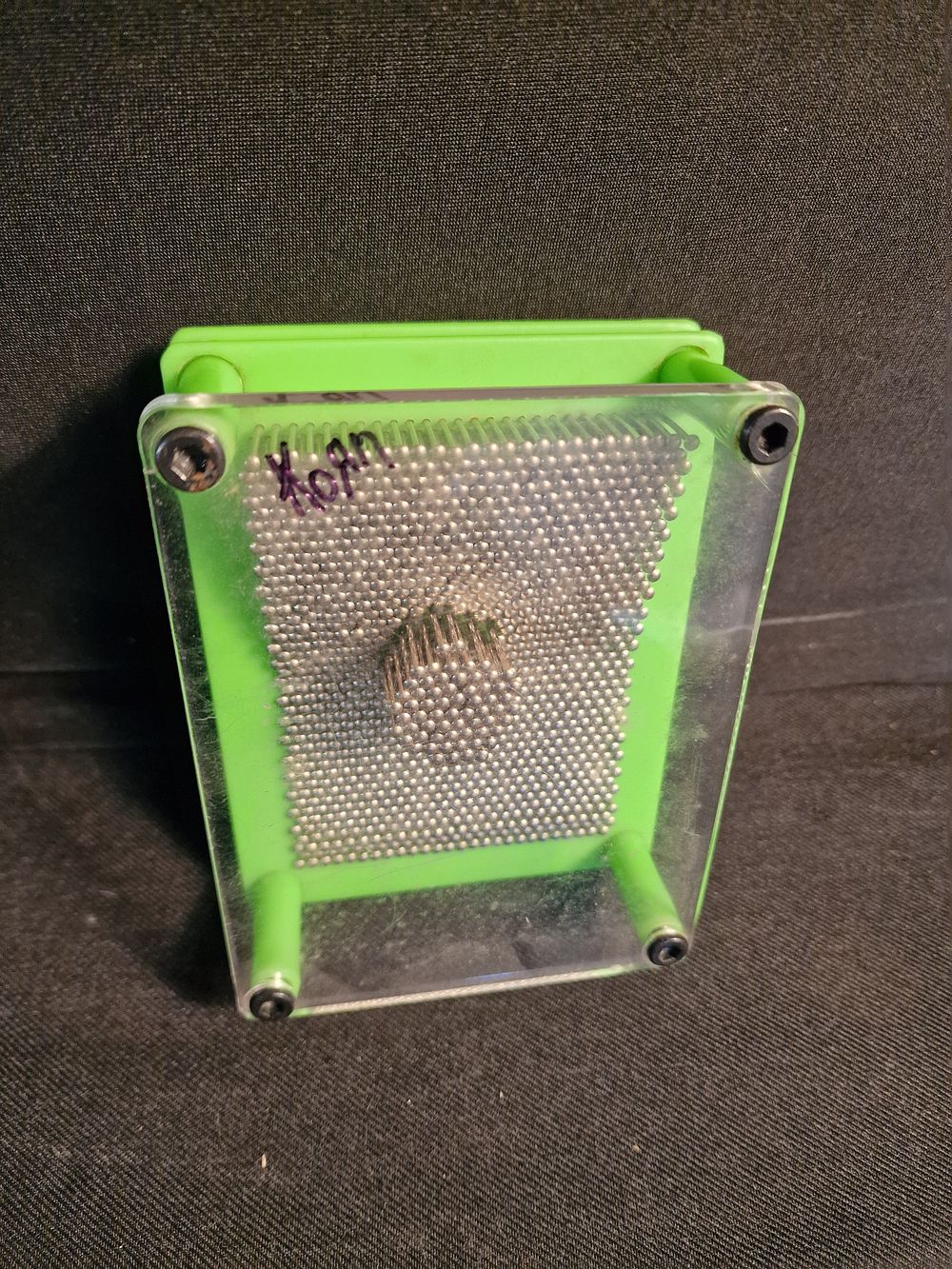 Lot 377: Press Pin Toy