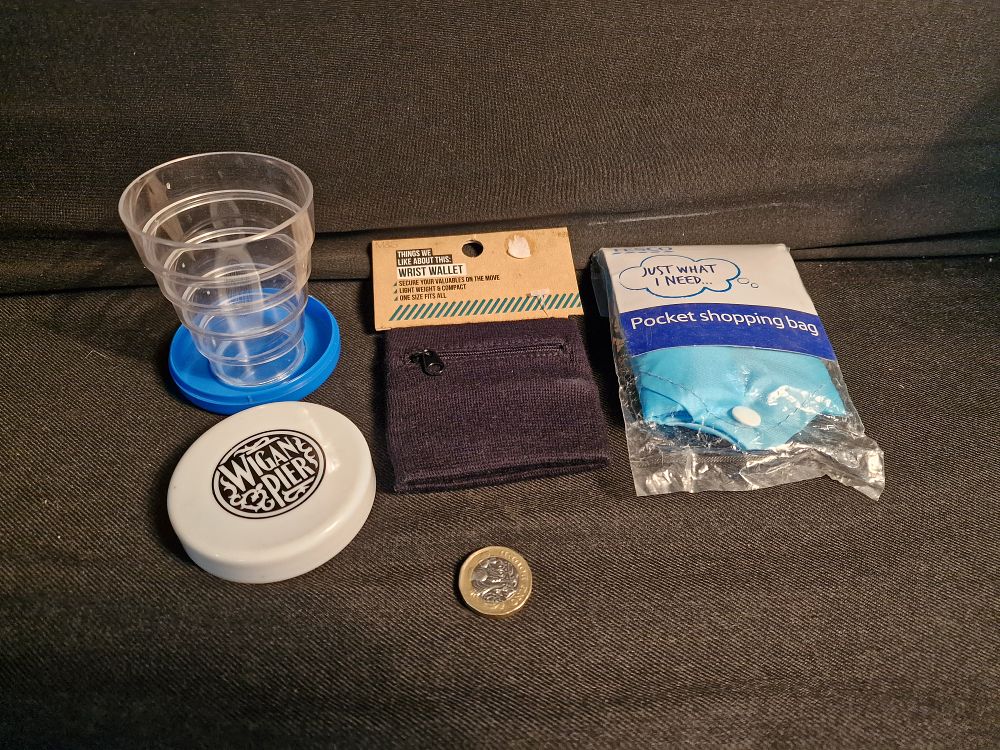 Lot 378: Wrist Wallet, Pocket Shopping Bag and Folding Wigan Pier Glass