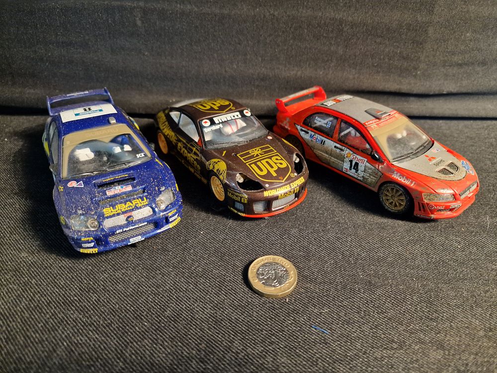 Lot 389: Hornby and Scalextric Slot Cars Play Worn a/f
