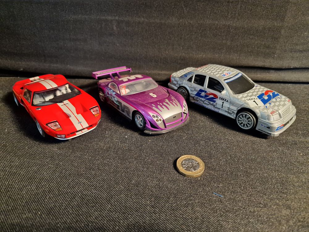 Lot 390: Hornby and Scalextric Slot Cars Play Worn a/f