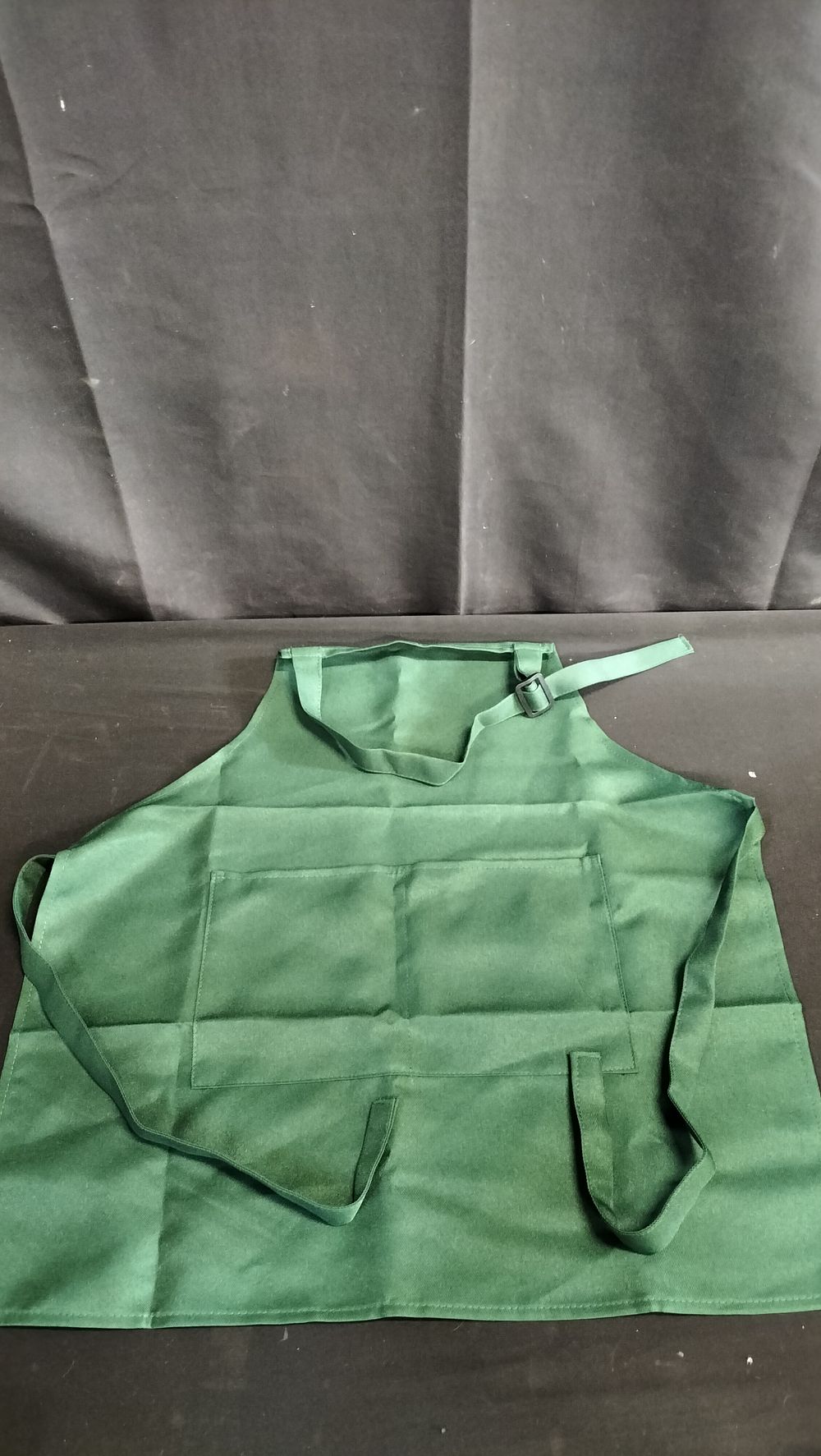 Lot 727: Two children's green apron with pocket