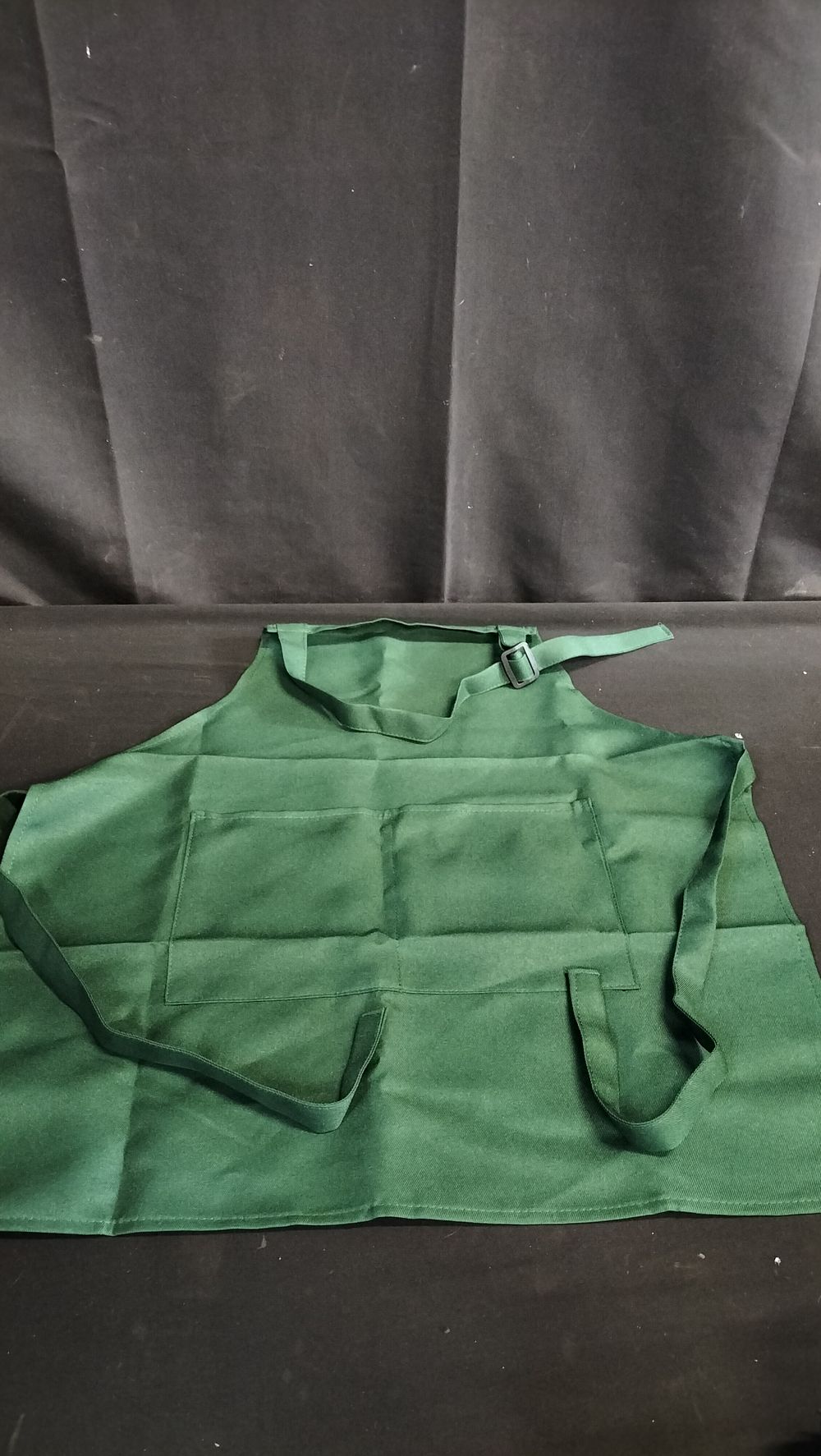 Lot 728: Two children's green apron with pocket 