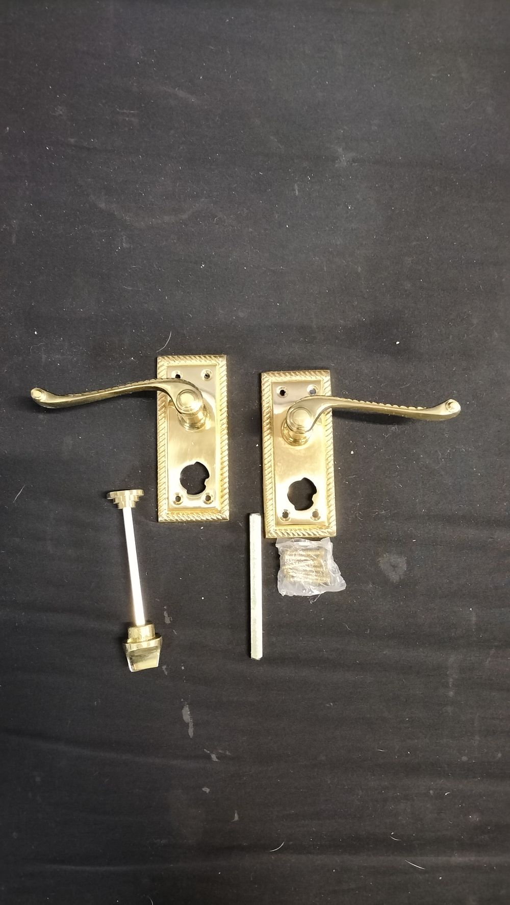 Lot 759: Brass door handles and hardware 