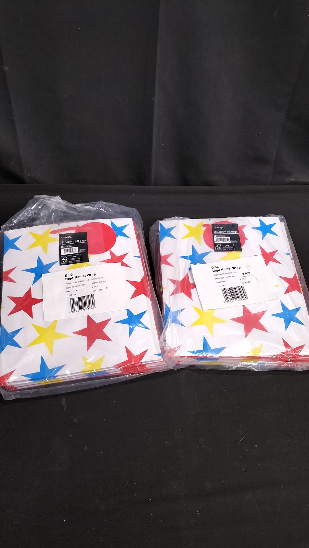 Lot 780: Two packs of 6 gift bags 12 in...